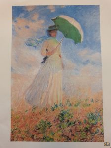 Monet, vrouw met parasol in het veld